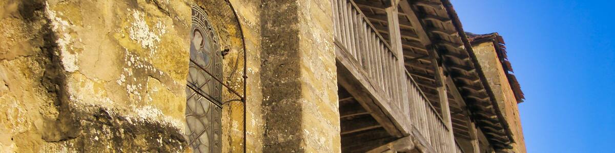 Medieval wooden balcony in a street in Plazac,Dordogne, France