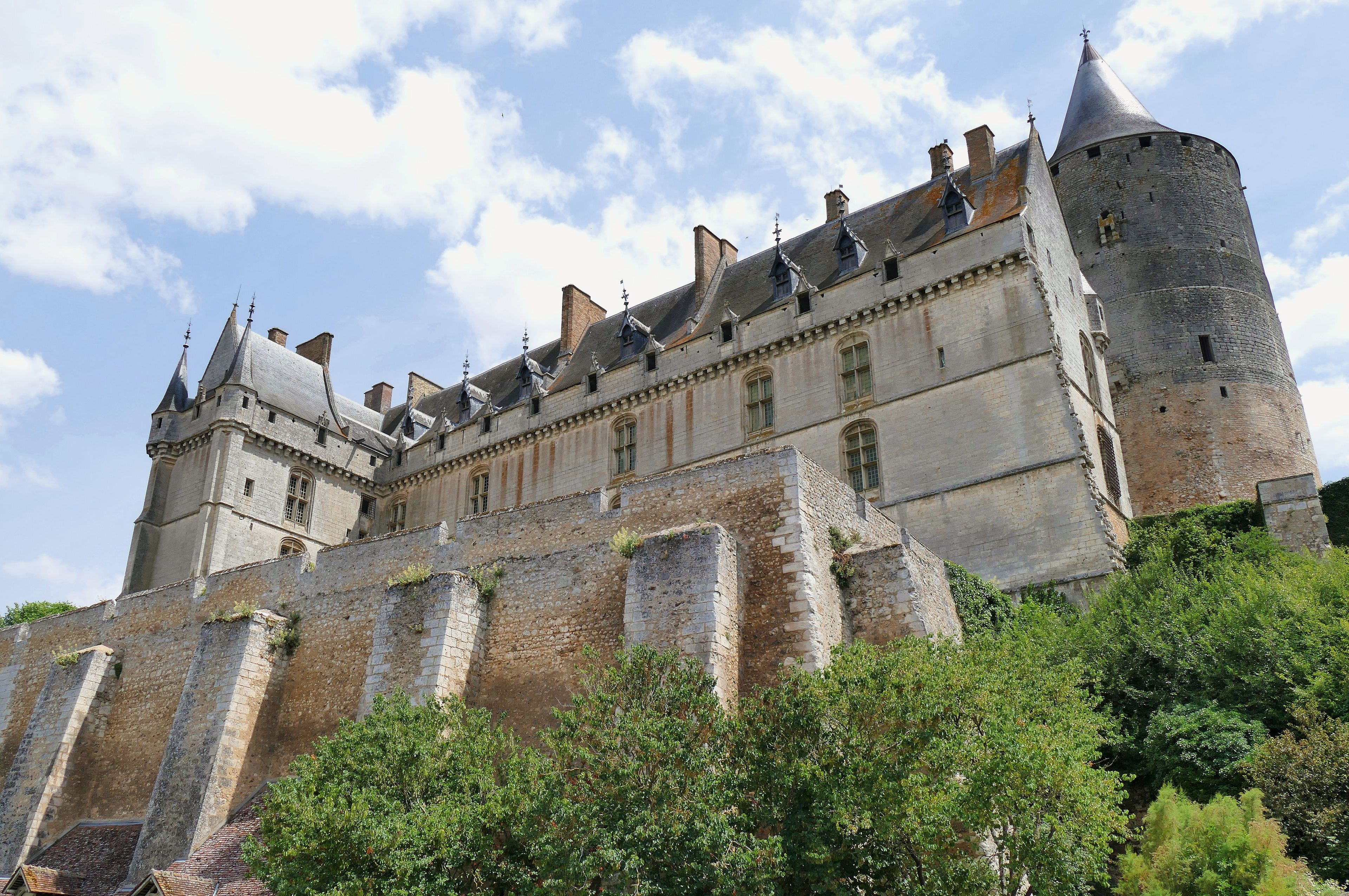 A historic castle with multiple towers and a fortified wall.