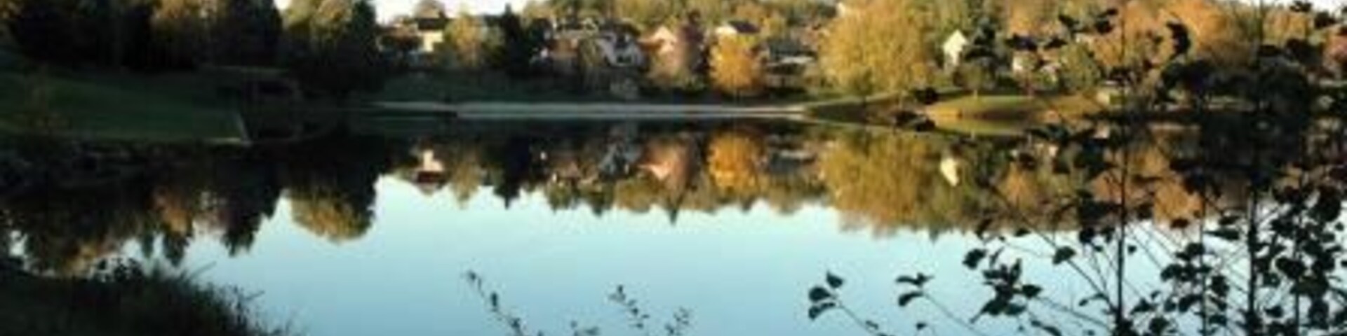 View of the french town of Meuzac, in the Haute-Vienne (Limousin) region, seen from the La Roche Lake.