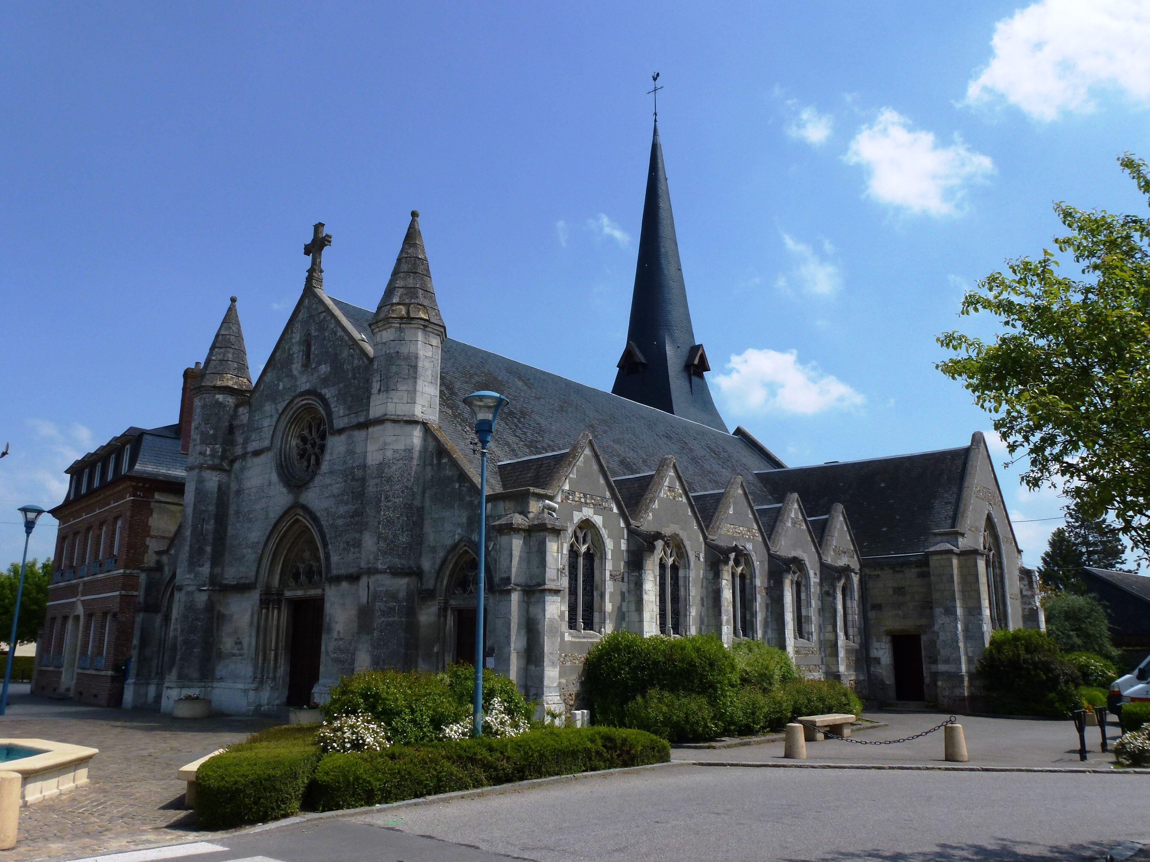 A historic church with a tall spire and multiple pointed towers.