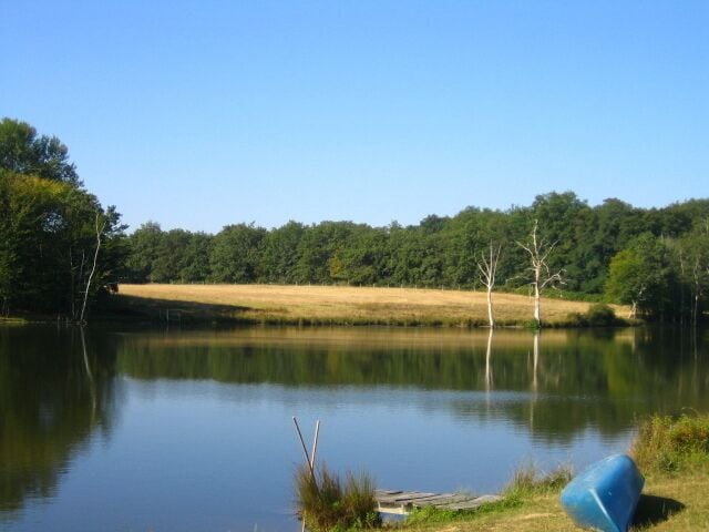 The manmade lake in Boisbuchet is inviting on a hot summer day. Canoe is waiting and ready for use. 