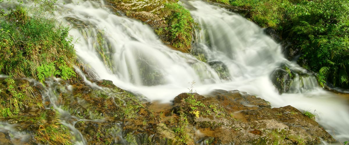 This file was uploaded with Commonist. La Savoureuse à Lepuix. Photo réalisée avec un filtre Hoya ND400 + le filtre ND8 intégré du Nikon Coolpix P7100 activé.