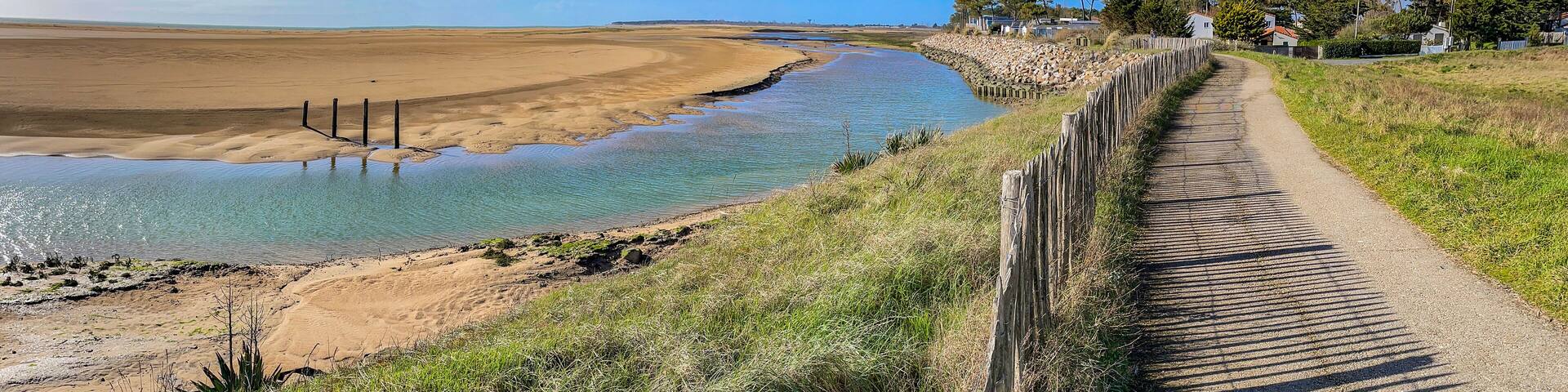 pedestrian path on the seaside in the nature reserve of the beautiful henriette in vendee, faute sur mer , france