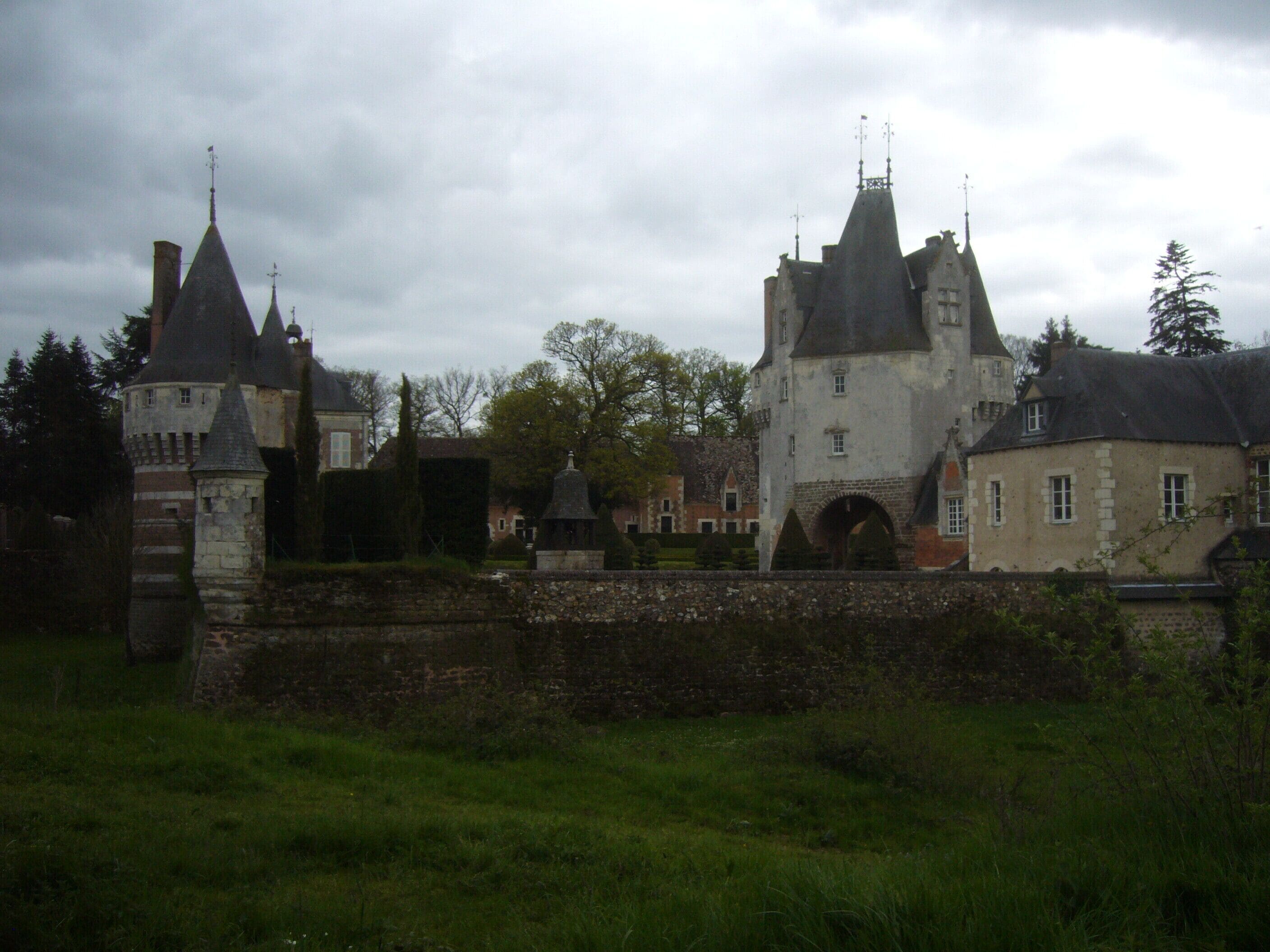 A historic castle with multiple towers and a moat.