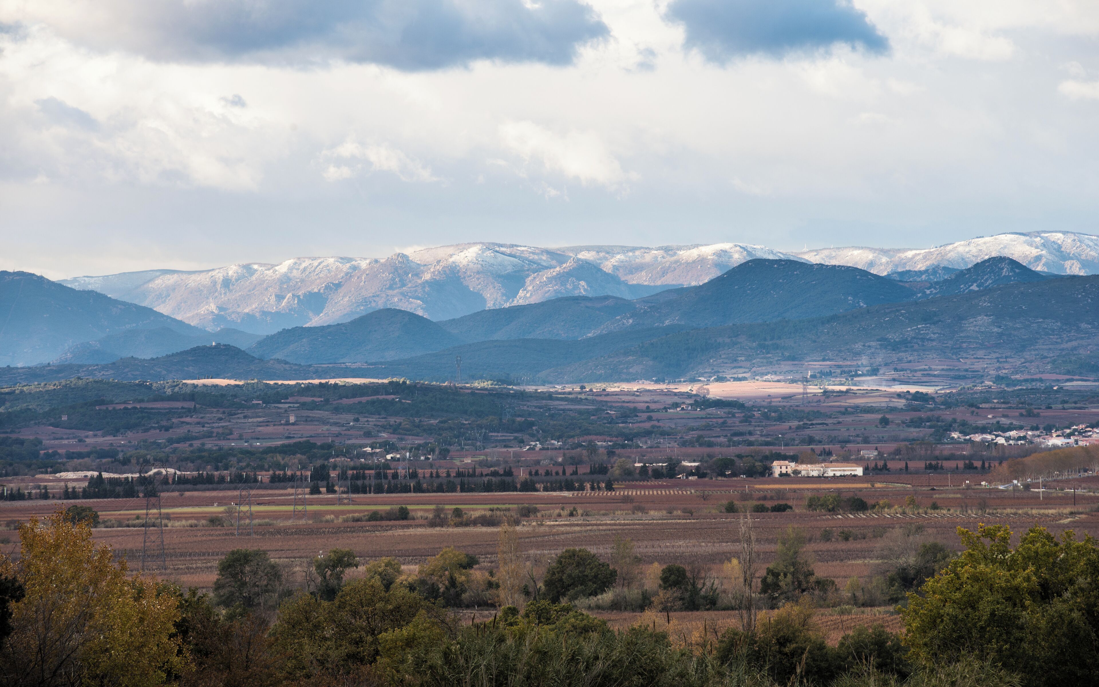 The "Montagne Noire" (Black Mountain) and a part of the commune of Thézan-lès-Béziers from the Southeast in the commune of Corneilhan, Hérault, France.