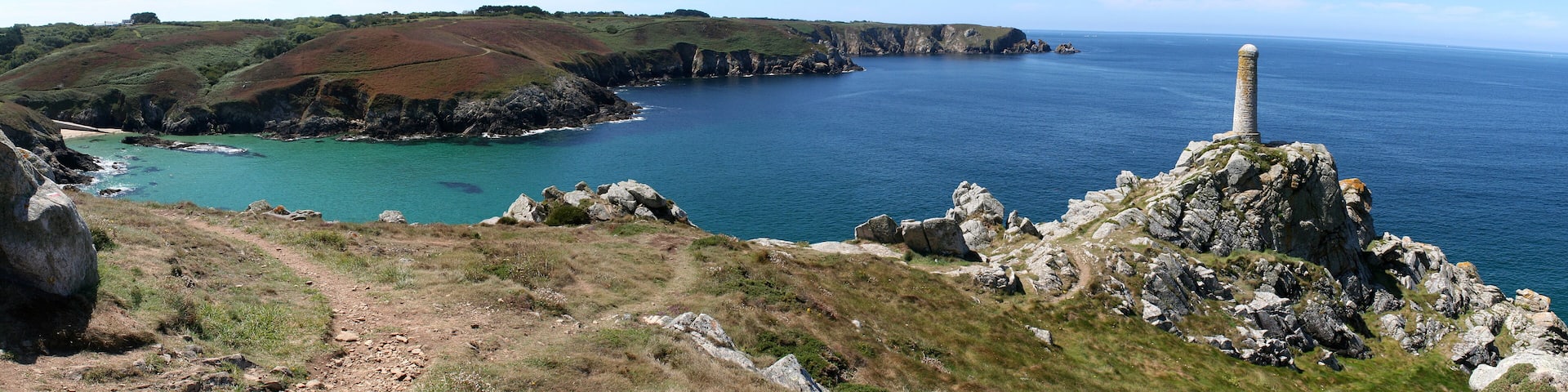 Theolen Beach, between Brézellec Point and Castelmeur Point, with the latter visible in the background, and and a daymark in the foreground. This beach is one or the rare places where beaching is possible in the north coast of Cap Sizun. FinistÚre département, Brittany, France.