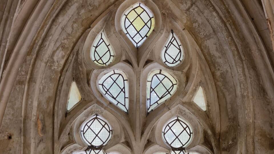 A Gothic-style window with a diamond pattern.