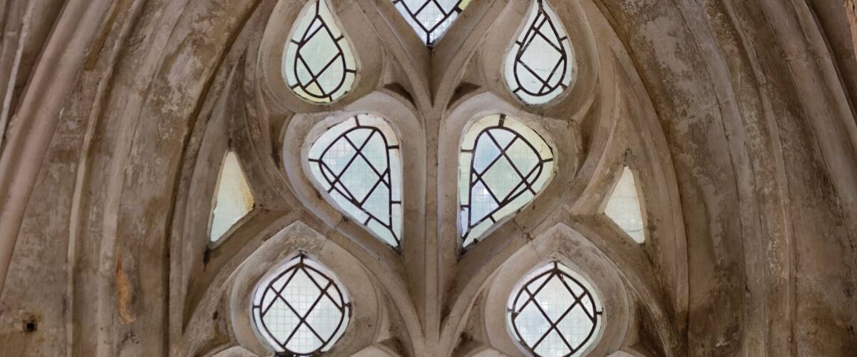 A Gothic-style window with a diamond pattern.