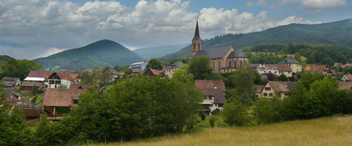 A village with a prominent church and surrounding houses.