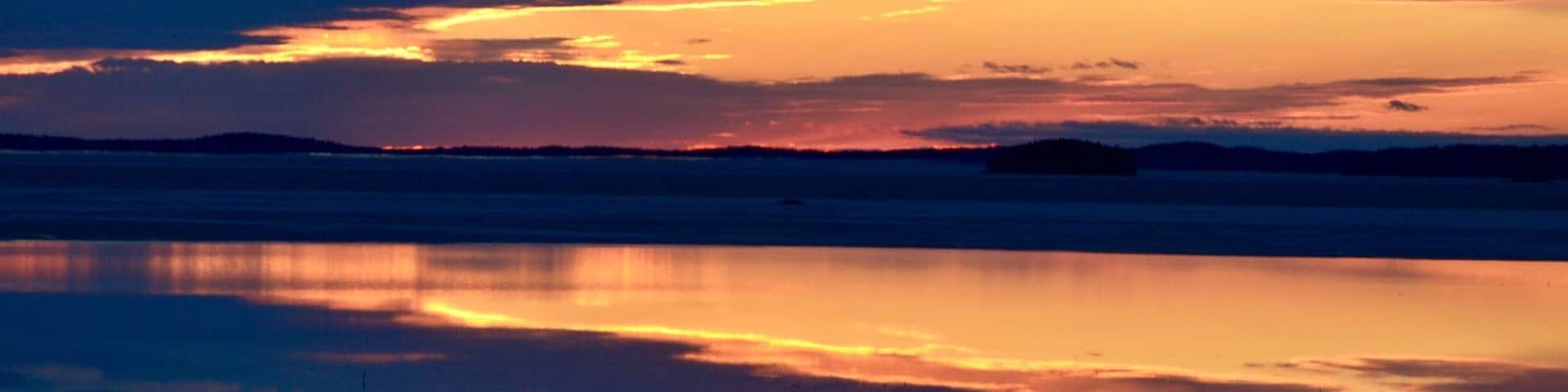 Sunset in Finland, lakes like mirrors.