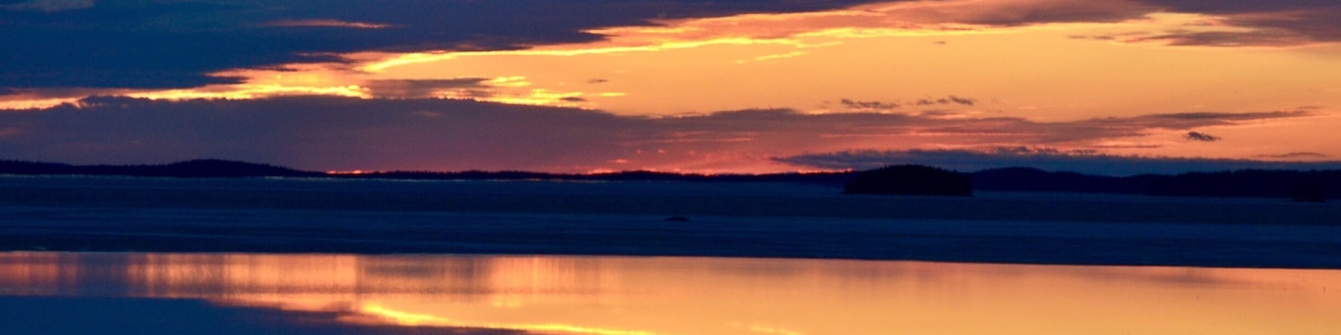Sunset in Finland, lakes like mirrors.