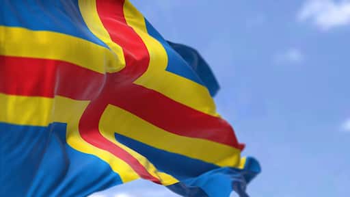 The flag of Aland Island waving in the wind on a clear day