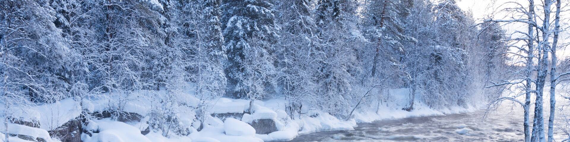 River rapids in Käylä near Kuusamo, Northern Finland on a cold winter morning.