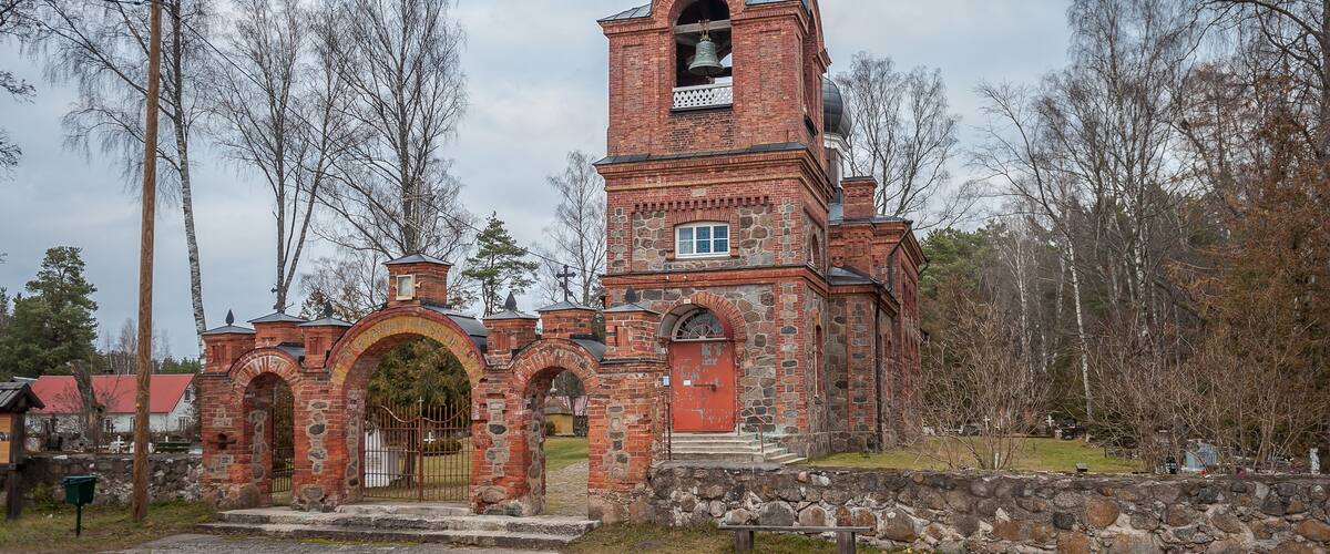 Road comes from gates to Varska orthodox church. Estonia.