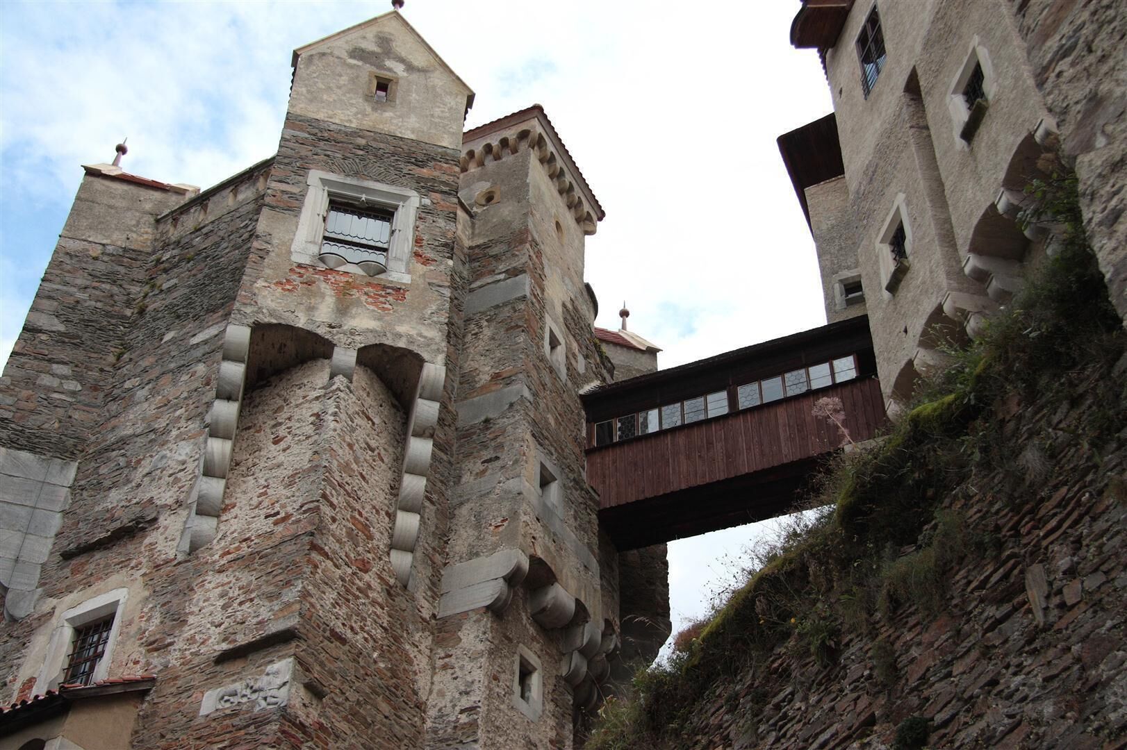 Pernštejn Castle (Czech: hrad Pernštejn) is a castle on a rock above the village of Nedvědice and the rivers Svratka and Nedvědička, some 40 kilometres (25 mi) northwest of Brno, in the South Moravian Region, Czech Republic. Pernštejn came to be known as the marble castle because of the marble-like stone used to frame the doors and windows.
https://en.wikipedia.org/wiki/Pern%C5%A1tejn_Castle