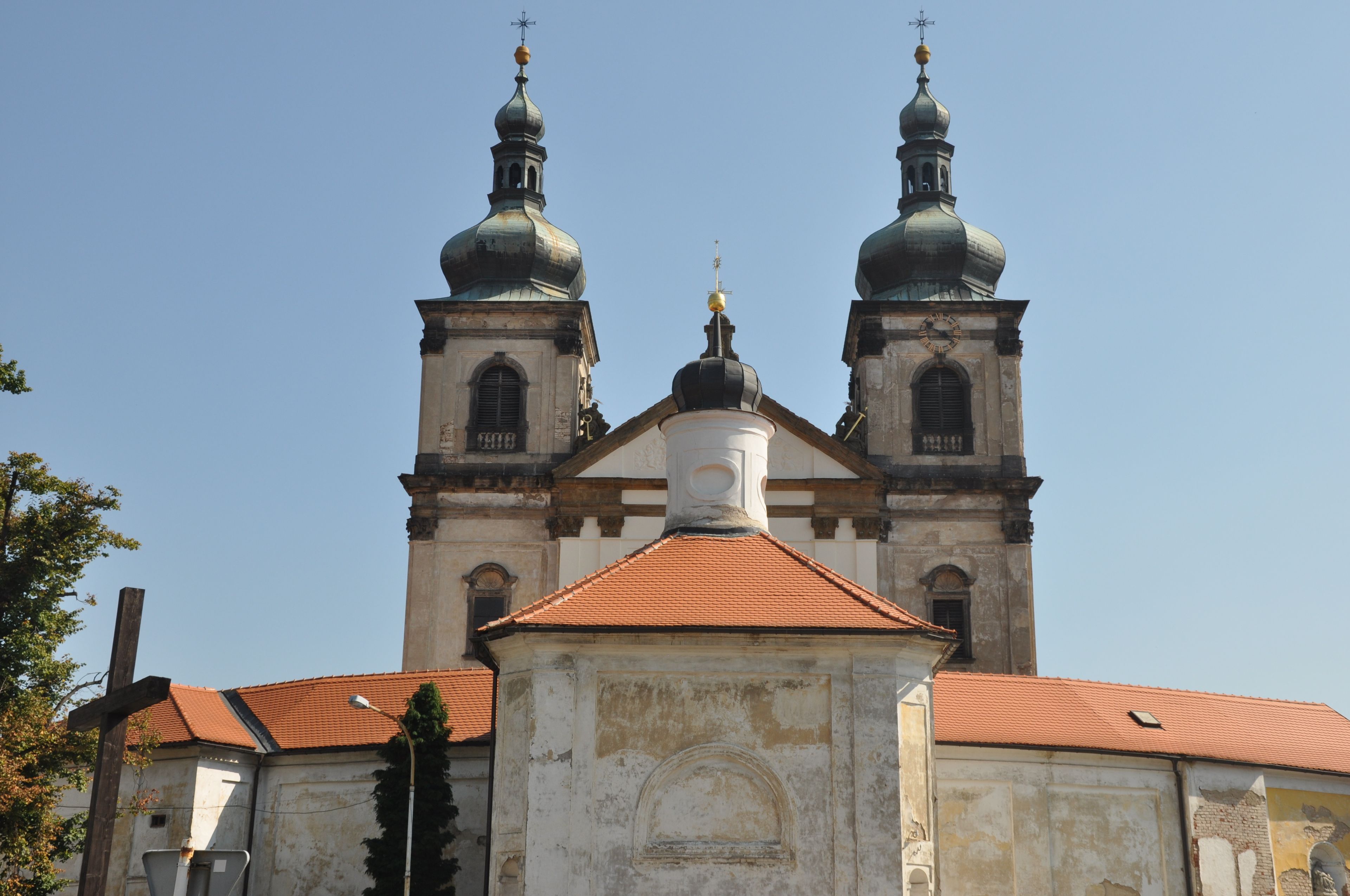 A church with two domes and a central tower.
