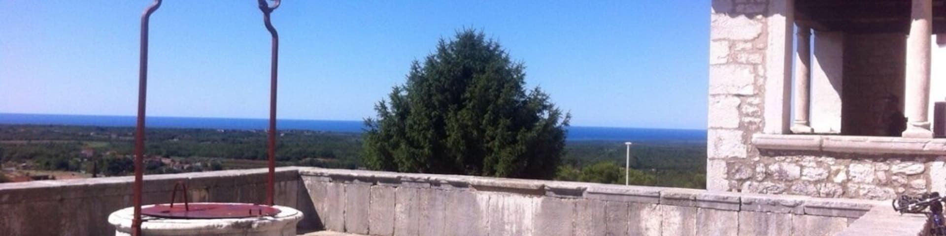 Old part of Visnjan- partly surrounded by town walls built in the 13th and 14th century the square is adorned by a 27m high bell tower, 18th century municipal loggia and the Parish church of SS. Quiricus and Julita.