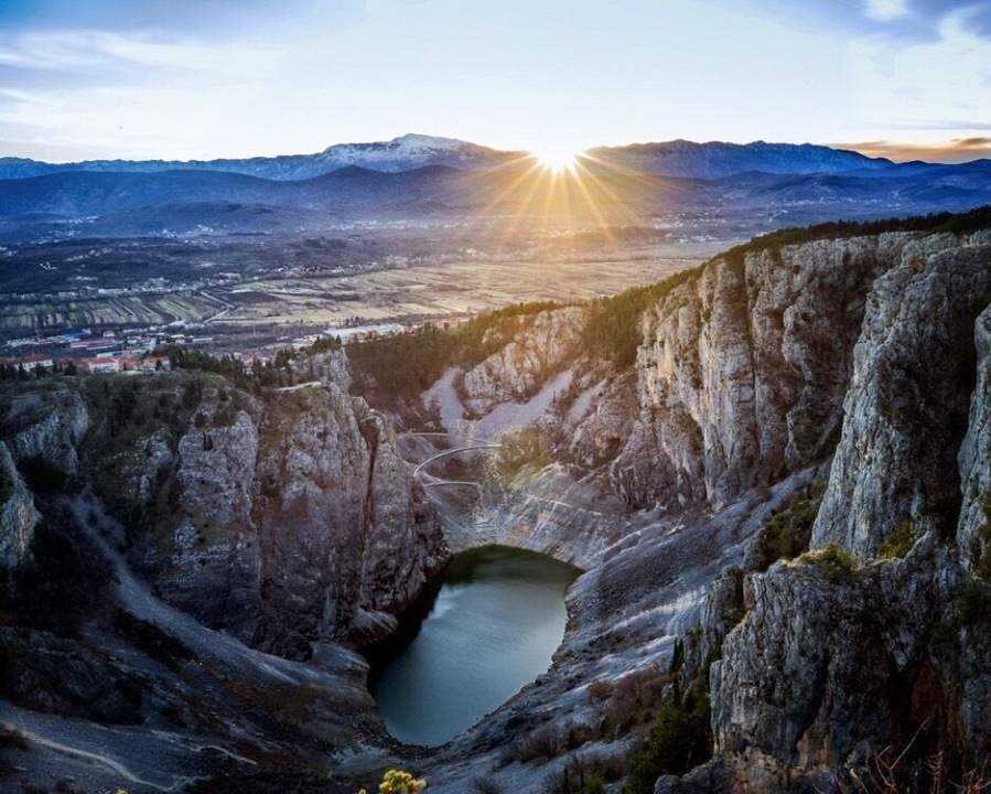 Blue Lake *
(Croatian: Modro jezero or Plavo jezero) is a karst lake located near Imotski in southern Croatia. Like the nearby Red Lake, it lies in a deep sinkhole possibly formed by the collapse of an enormous underground cave. The total depth from the upper rim is around 220 meters, while water depth varies with season. In spring, when the snow from surrounding mountains melts, it can reach 90 m, and in 1914 it reached 114 m, overflowing the southern rim. The lake is a popular destination for hiking and sight-seeing.
Maximum dimensions of the lake are around 800×500 m, but they significantly vary due to big changes in the water level. At the end of the summer the lake may completely disappear.
In 1907 a road was built descending to the lake. In 1942, an earthquake caused a large landfall resulting in reduction of the lake's depth.
#croatia #modrojezero #lake #imotski