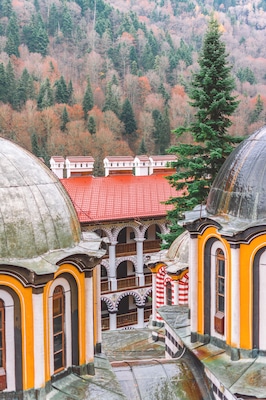 The domes of the church "Nativity of the Virgin Mother" are one of the most distinguishable parts of the Rila Monastery.⠀
This is the main church in the monastery and was erected in 1837 after the demolishing of the original church.⠀
⠀
The frescoes inside, the gold-plated iconostasis, the altars, and icons are amazing pieces of art! ⠀
⠀
It was forbidden to take pictures inside the church but I can tell you - you will not get bored by the gold and the wood-carving! It's breathtaking! 🙌🏻🧡