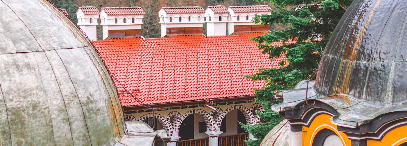 The domes of the church "Nativity of the Virgin Mother" are one of the most distinguishable parts of the Rila Monastery.⠀
This is the main church in the monastery and was erected in 1837 after the demolishing of the original church.⠀
⠀
The frescoes inside, the gold-plated iconostasis, the altars, and icons are amazing pieces of art! ⠀
⠀
It was forbidden to take pictures inside the church but I can tell you - you will not get bored by the gold and the wood-carving! It's breathtaking! 🙌🏻🧡