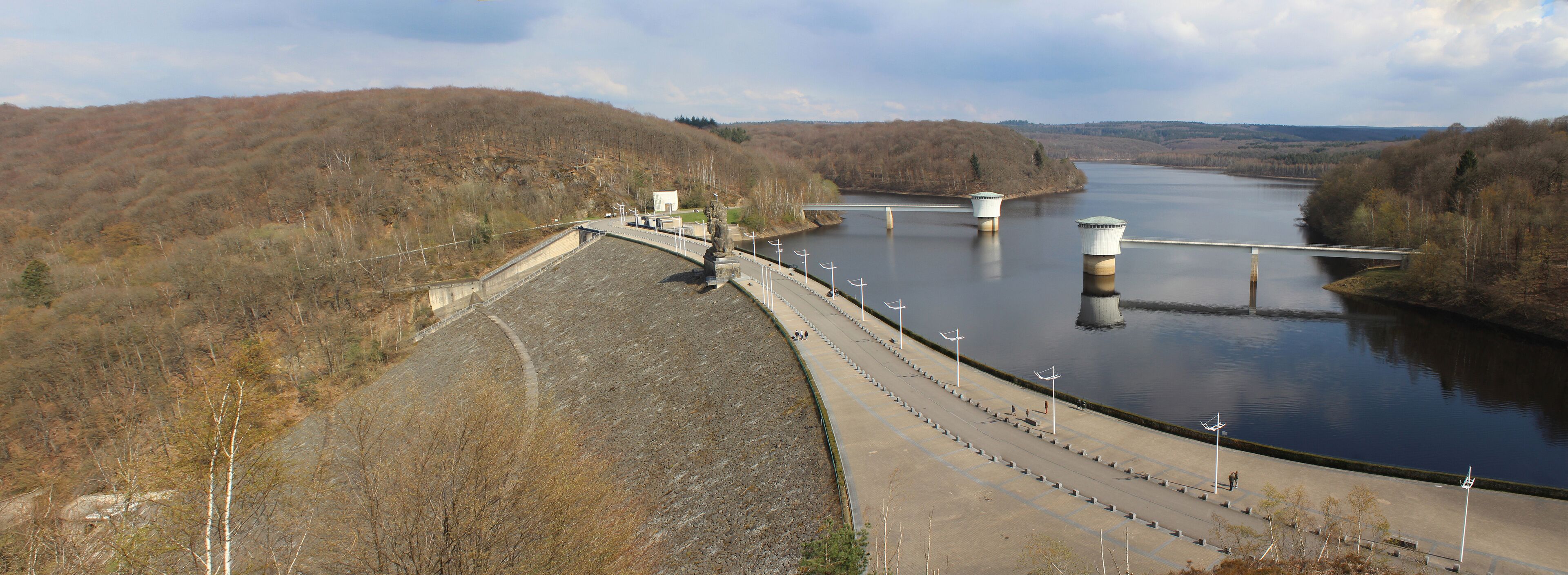 A dam with spillways and a bridge over a river.