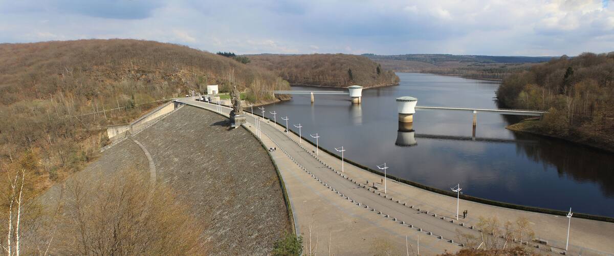 A dam with spillways and a bridge over a river.