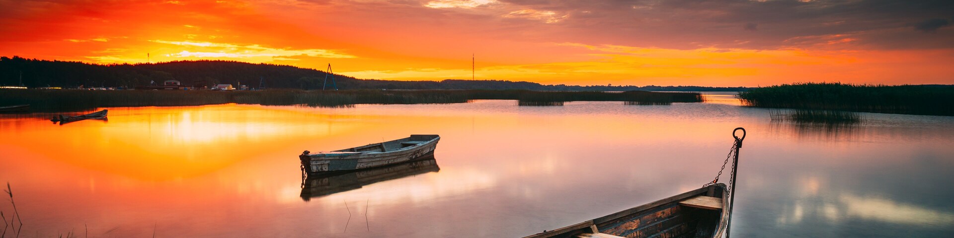 Braslaw Or Braslau, Vitebsk Voblast, Belarus. Wooden Rowing Fishing Boats In Beautiful Summer Sunset On The Dryvyaty Lake. This Is The Largest Lake Of Braslav Lakes. Typical Nature Of Belarus