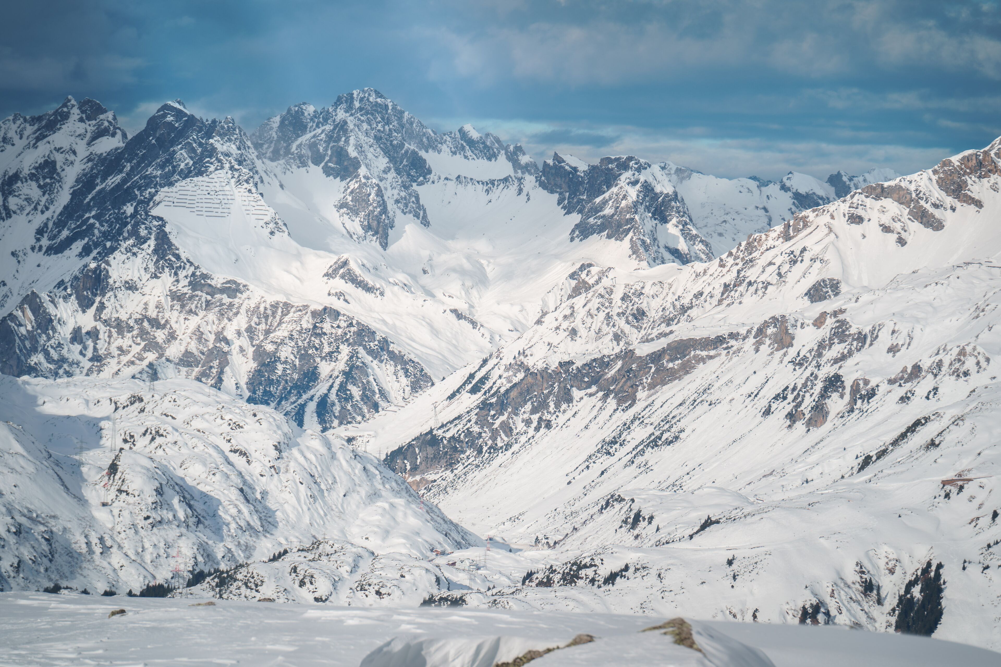 Majestic snow-covered mountain peaks in the Ski Arlberg skiing arena in Austria around Sankt Christoph am Arlberg displays the best conditions for the skiing slopes