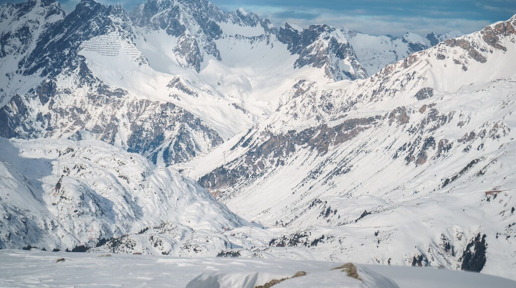 Majestic snow-covered mountain peaks in the Ski Arlberg skiing arena in Austria around Sankt Christoph am Arlberg displays the best conditions for the skiing slopes