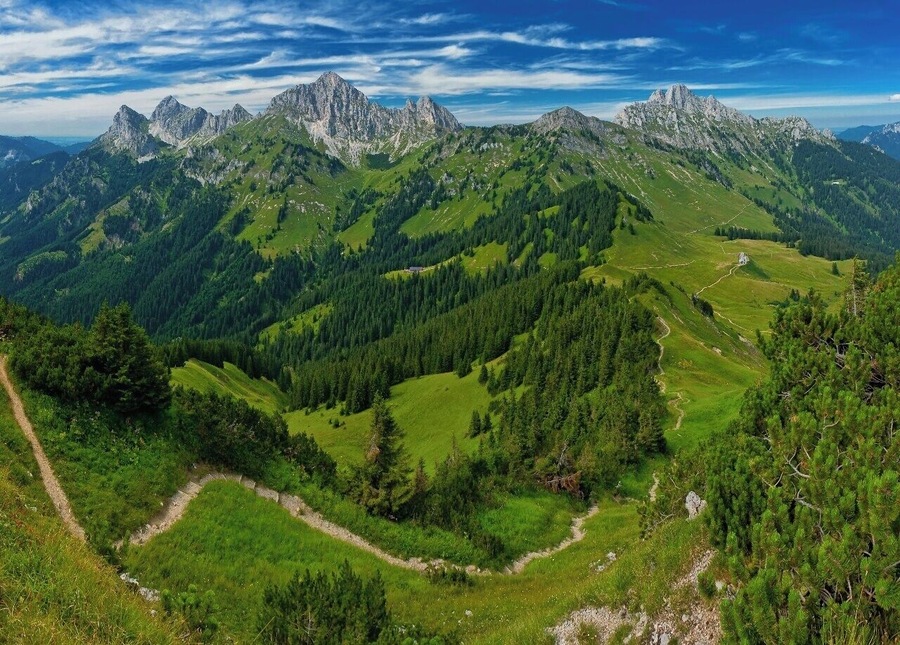July 2015
Tannheimer Berge, Austria 
The highest part of Tannheimer Berge mountains with summits Gimpel (2.173 m), Koellenspitze (2.238 m), Schneid (2.009 m) and Gehrenspitze (2.163 m). Tannheimer Berge belong to Allgaeuer Alps and Northern Limestone Alps and are very popular for sports climbing. The plateau below is the Schneetalalm and Schneetalalpe is suitable for easy hiking eg. from Hahnenkamm.