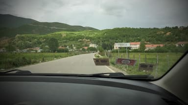 Well, despite being told not to go because a) 'there isn't anything out there' and b) 'you shouldn't trust anyone in the area', I encourage you to head there and sleep there for one night.
Why?
Because of the green hills and red earth that surround this village, vilified in 'Taken' and 'Taken 2', which could serve as an excellent base camp for some hiking, plus the Kosovo border crossing is very close - if you're heading there.
P.S. People are still very friendly, as is the case in the whole of Albania.