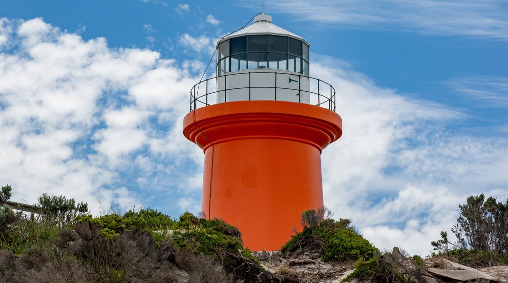 The iconic red Cape banks lighthouse with blue sky and white clouds located at Carpenters Rocks South Australia on November 9th 2020