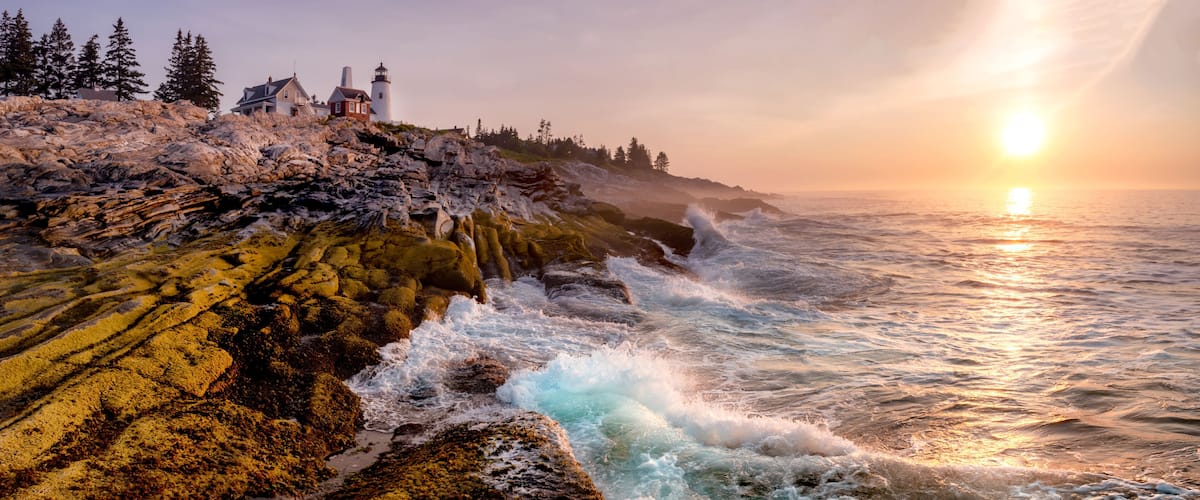 Lighthouse on the Coast at Sunrise. Pemaquid Point Light, Maine, USA.