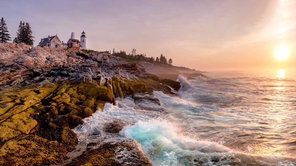 Lighthouse on the Coast at Sunrise. Pemaquid Point Light, Maine, USA.