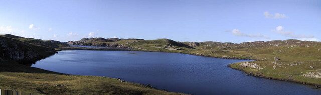 Loch Sandig A small loch with a sandy bottom and several areas of weed which is divided from the sea by a narrow line of rocks and sand. It seems likely that the sea frequently enters the loch over the top of the rocks, especially in stormy weather. Despite this the loch holds a small head of tiny brown trout.