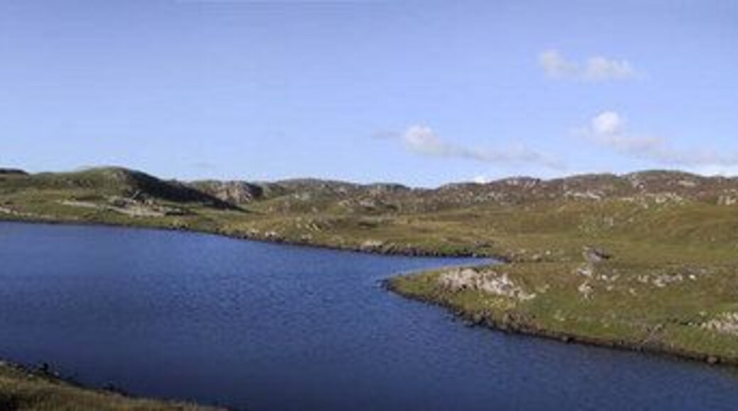 Loch Sandig A small loch with a sandy bottom and several areas of weed which is divided from the sea by a narrow line of rocks and sand. It seems likely that the sea frequently enters the loch over the top of the rocks, especially in stormy weather. Despite this the loch holds a small head of tiny brown trout.