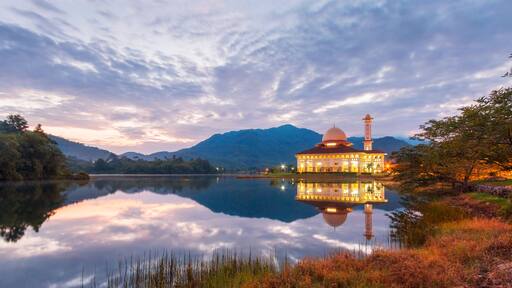 Beautiful view of Darul Quran mosque with reflections during sunset at Kuala Kubu, Selangor, Malaysia.
