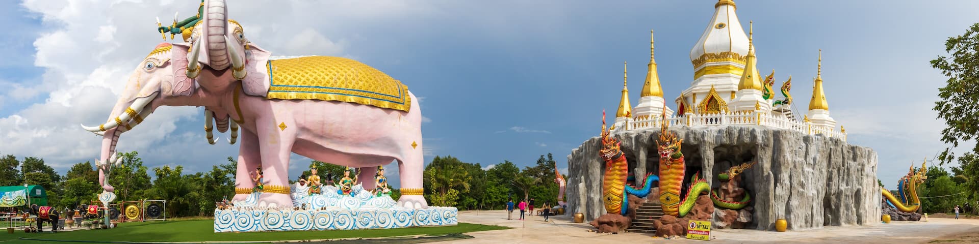 Mukdahan, Thailand - July 31, 2022: large 3-headed elephant statue, Naga at the entrance of the church at Dan Phra In Temple, Nikhom Kham Soi, Mukdahan, Thailand.