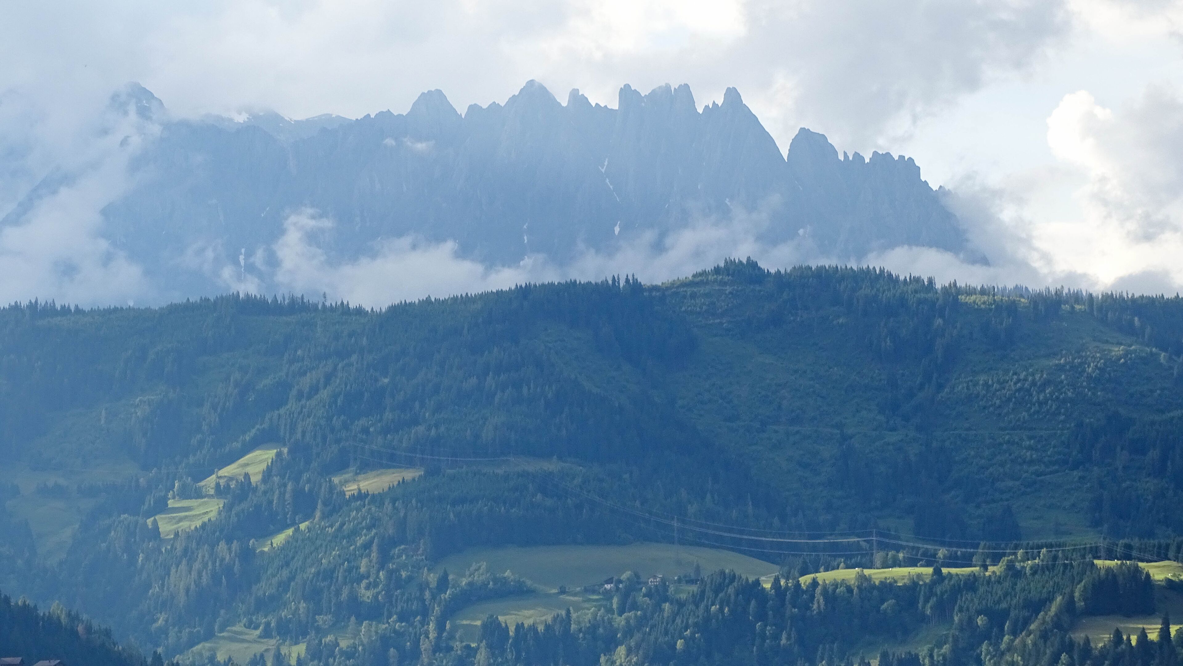 Green Austrian Alps near Alpendorf in rainy summer day, June 27, 2016..