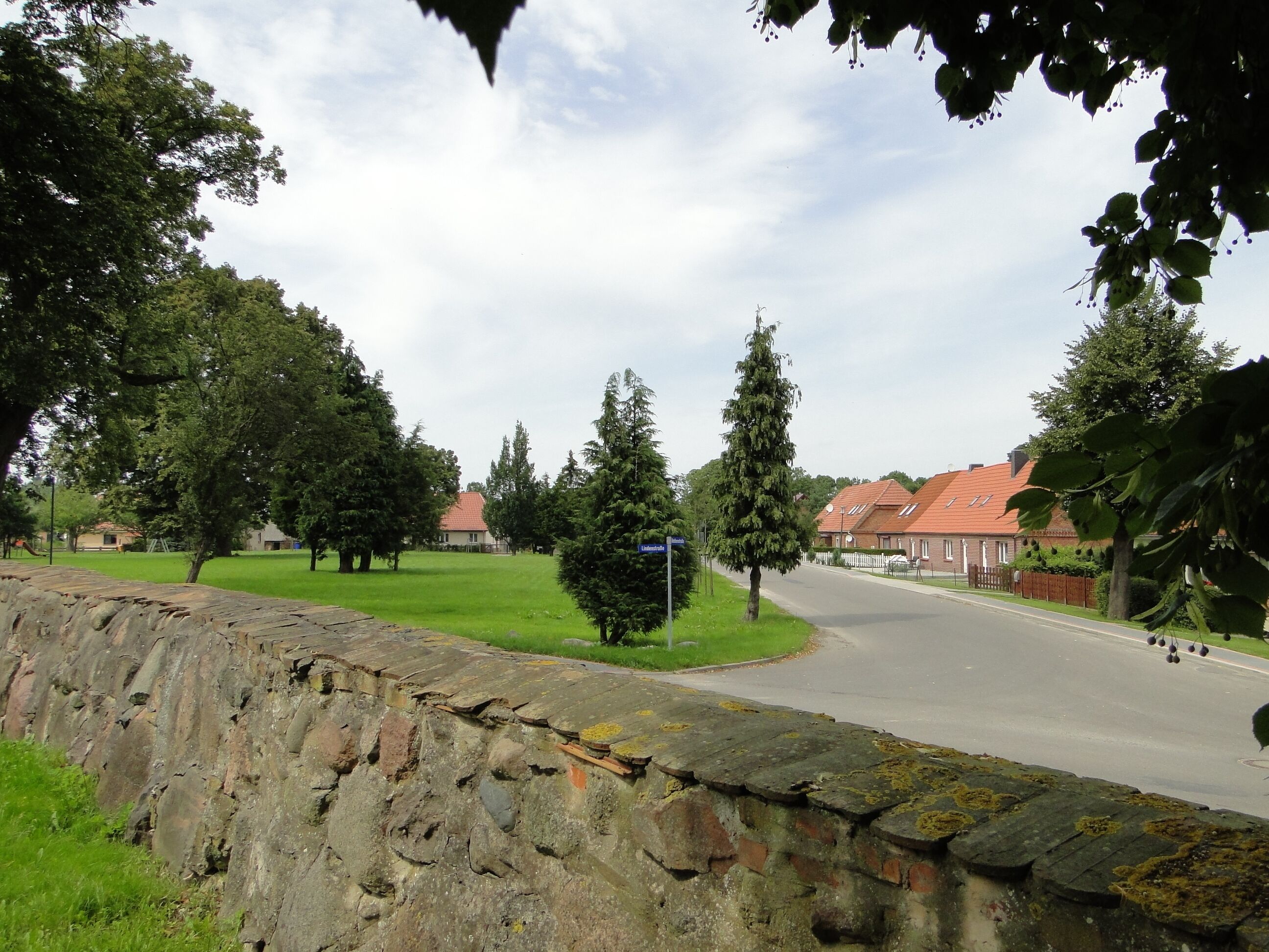 Church wall and street in Jatzke, district Mecklenburg-Strelitz, Mecklenburg-Vorpommern, Germany
