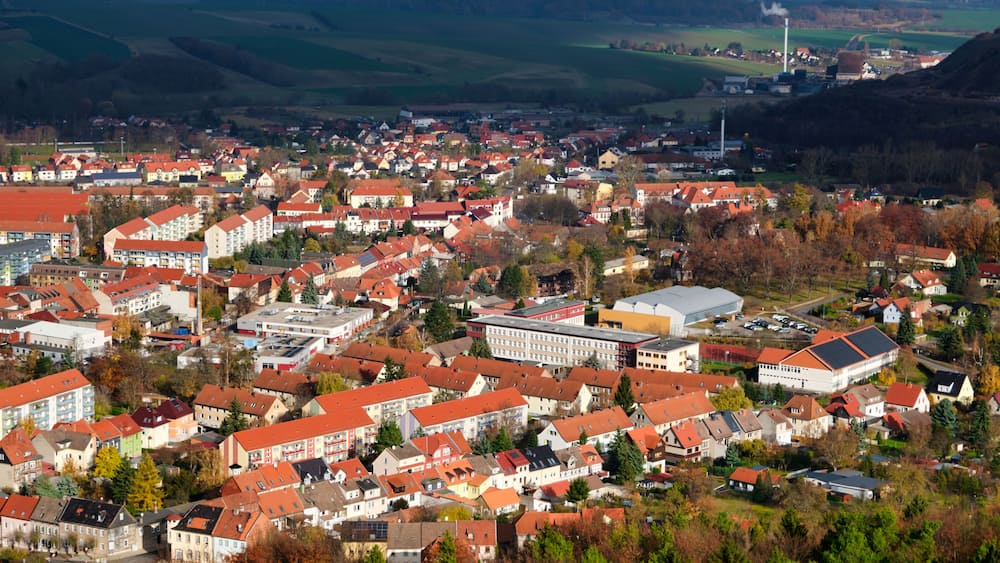 Houses and river in the city of Bleicherode, Germany. View from the top of german little city in autumn day.