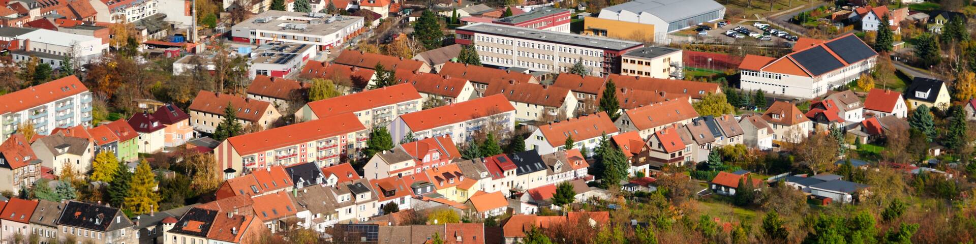 Houses and river in the city of Bleicherode, Germany. View from the top of german little city in autumn day.