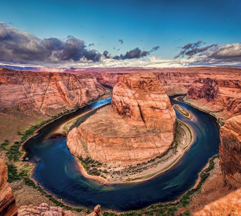 Located within a few hours drive from Las Vegas is this horseshoe shaped meander of the Colorado River. After a bit of a hike, we got to see the horseshoe bend. What an astounding beauty it was!
Also extremely nerve-wracking because it is a merciless 1000 feet drop from the canyon cliffs, and there are no rails at the edge of the cliffs. Being acrophobic made it worse! But it is an experience of a lifetime and I’m glad I mustered all of my courage (I have very little of it), prayed all the Gods in the world (although I believe there is only God) and peeked at the formation of the horseshoe bend among the deep gorges.
To get an elaborate view of the horseshoe bend, I lay down on my stomach and literally crawled on the canyon to reach the edges. The only thing I hoped is, the cliffs were strong enough to hold my weight. And here I was, literally at the edge of a 1000 feet high cliff with my palms sweating (literally!).