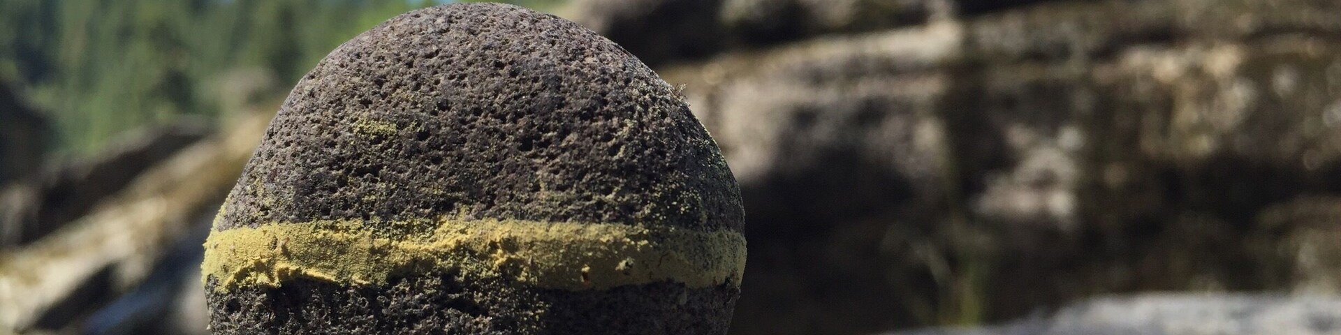 The first rock is about 2 inches in diameter, the one one the right is about 20 feet tall.