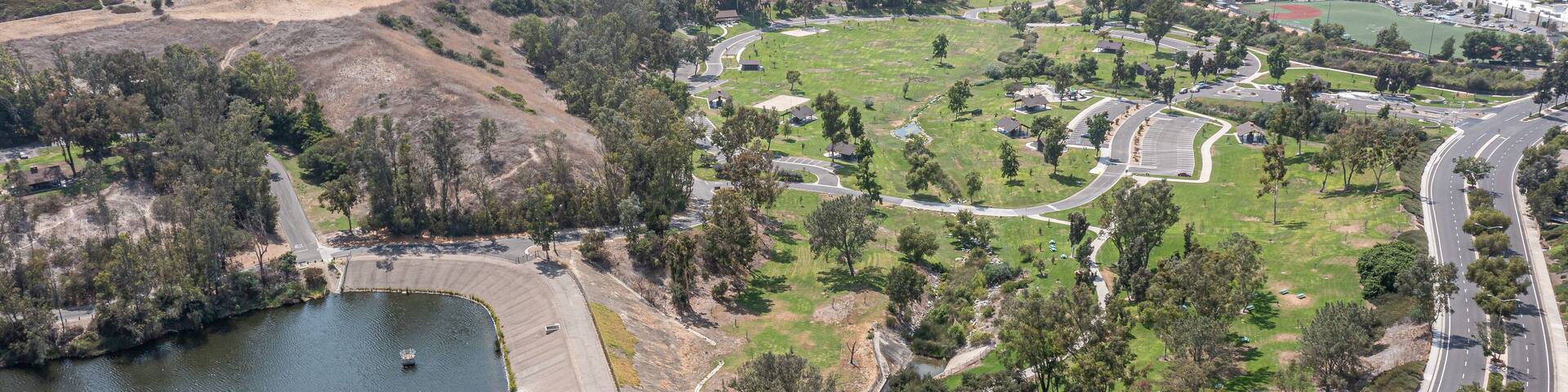 Aerial view of homes on a hill overlooking a lake in Southern California.