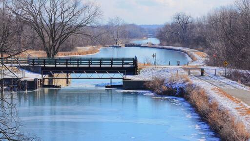 This is a photo from the top of a bridge showing the tiered lock system flowing west to east on the Hennepin Canal. From the feeder canal in Sheffield, Il, the water flows east to west AND west to east from the center of the pool. Difficult to explain:)