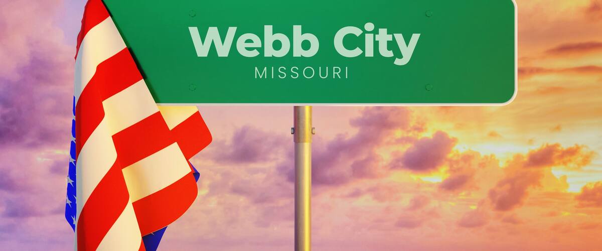 Webb City - Missouri/USA. Road or City Sign. Flag of the united states. Sunset Sky.