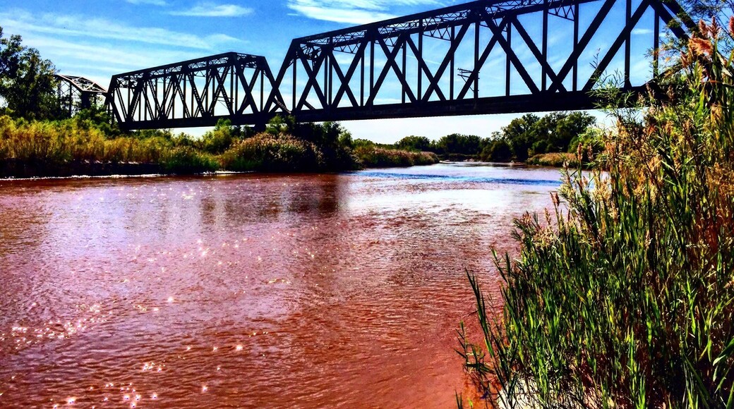 Park alongside the river road and hike west up the ATV trail to find this treasure.