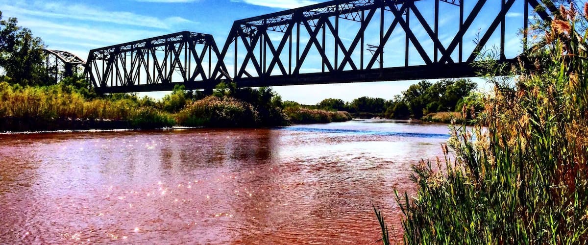 Park alongside the river road and hike west up the ATV trail to find this treasure.