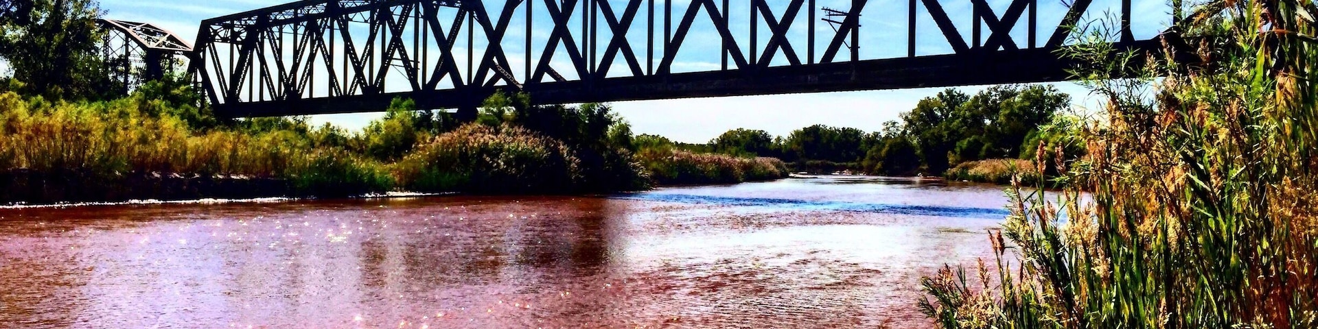 Park alongside the river road and hike west up the ATV trail to find this treasure.